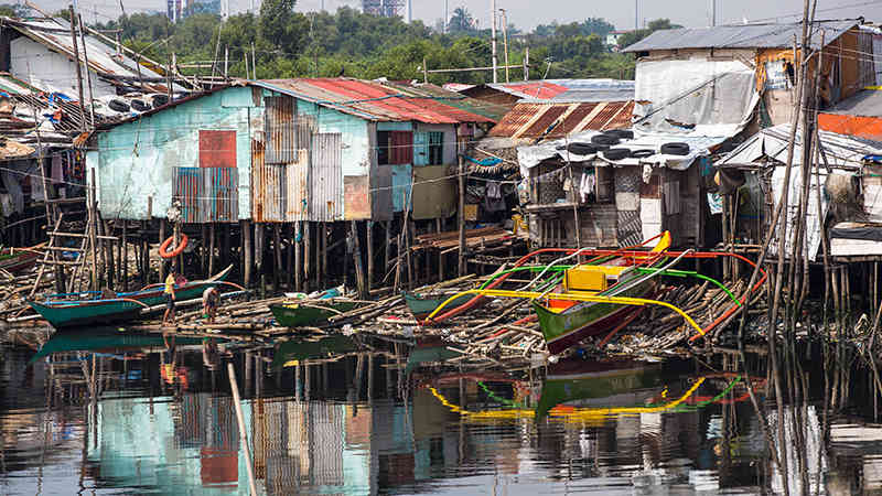 A water-side village in Philippines impacted by disaster.