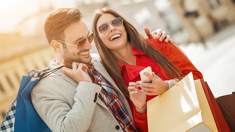 Happy man and woman shopping