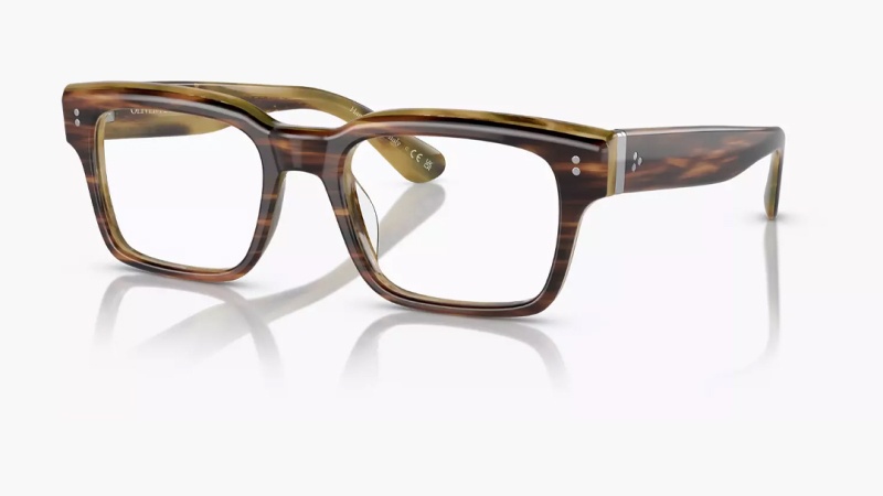 Pair of tortoiseshell square eyeglasses with thick frames, resting on a reflective white surface.